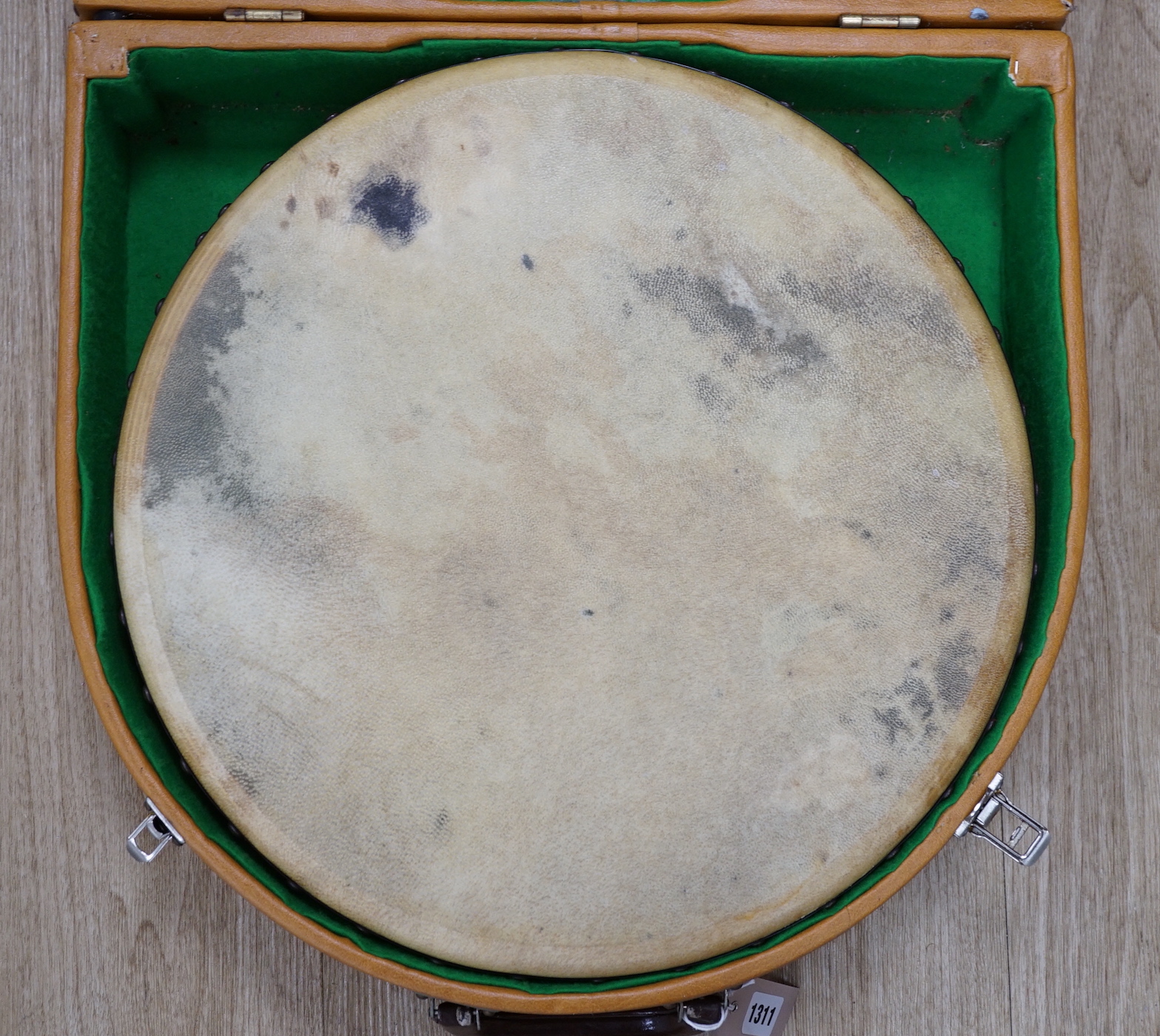 An Irish Bodhran drum with Celtic decorated plywood frame and goat skin, diameter 46cm, in fitted hard case, with beater